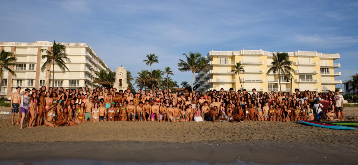 Some seniors pose for a group photo at the municipal beach near the Worth Avenue Clock Tower for “Senior Sunrise.” The event was unaffiliated with the school but organized by senior class presidents and digital media seniors Olivia Le and Joshua Molnar. (Ashwin Kishor)