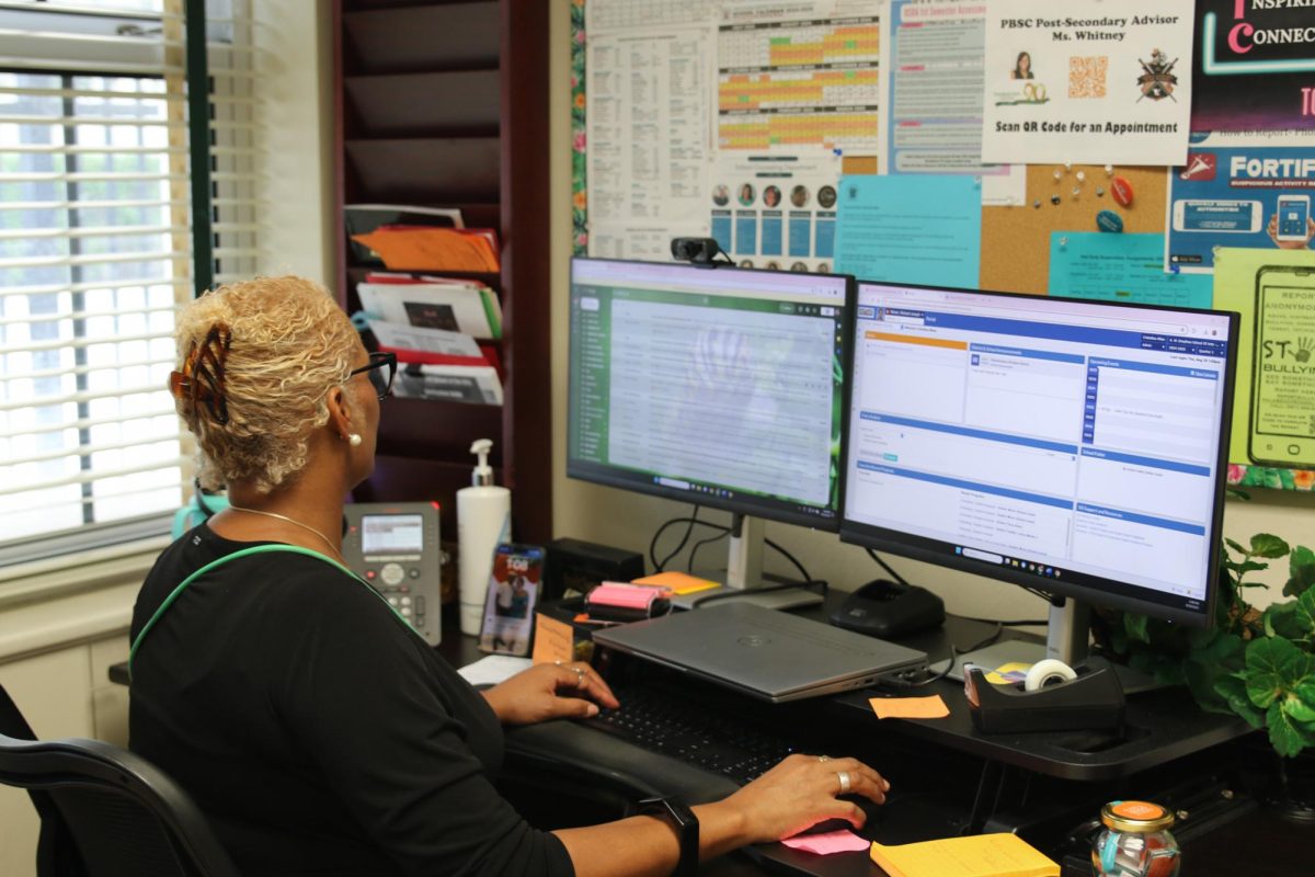 Checking her email and the school district portal, new musical theatre and vocal guidance counselor Christelina Milan views new student information. Since it was Ms. Milan’s first year, she dedicated time to familiarize herself with new students and school procedures.
