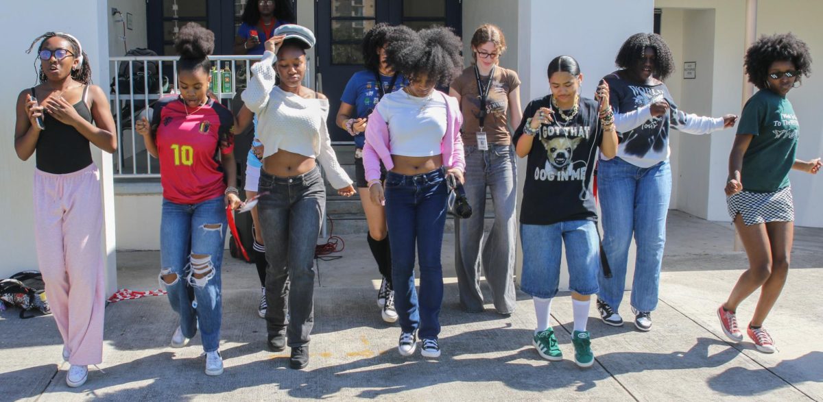 Dancing to the song “Flex” by Cupid, digital media freshman Sophie Jones and other students participate in the Black Student Union (BSU) field day on Feb. 10. BSU Spirit Week is an annual event that allows students to celebrate Black History Month through music, dance, and other activities. “Music unites everybody in the club because we all know a bunch of songs from growing up, so once we hear a song that we recognize, (we) all come together,” Jones said.