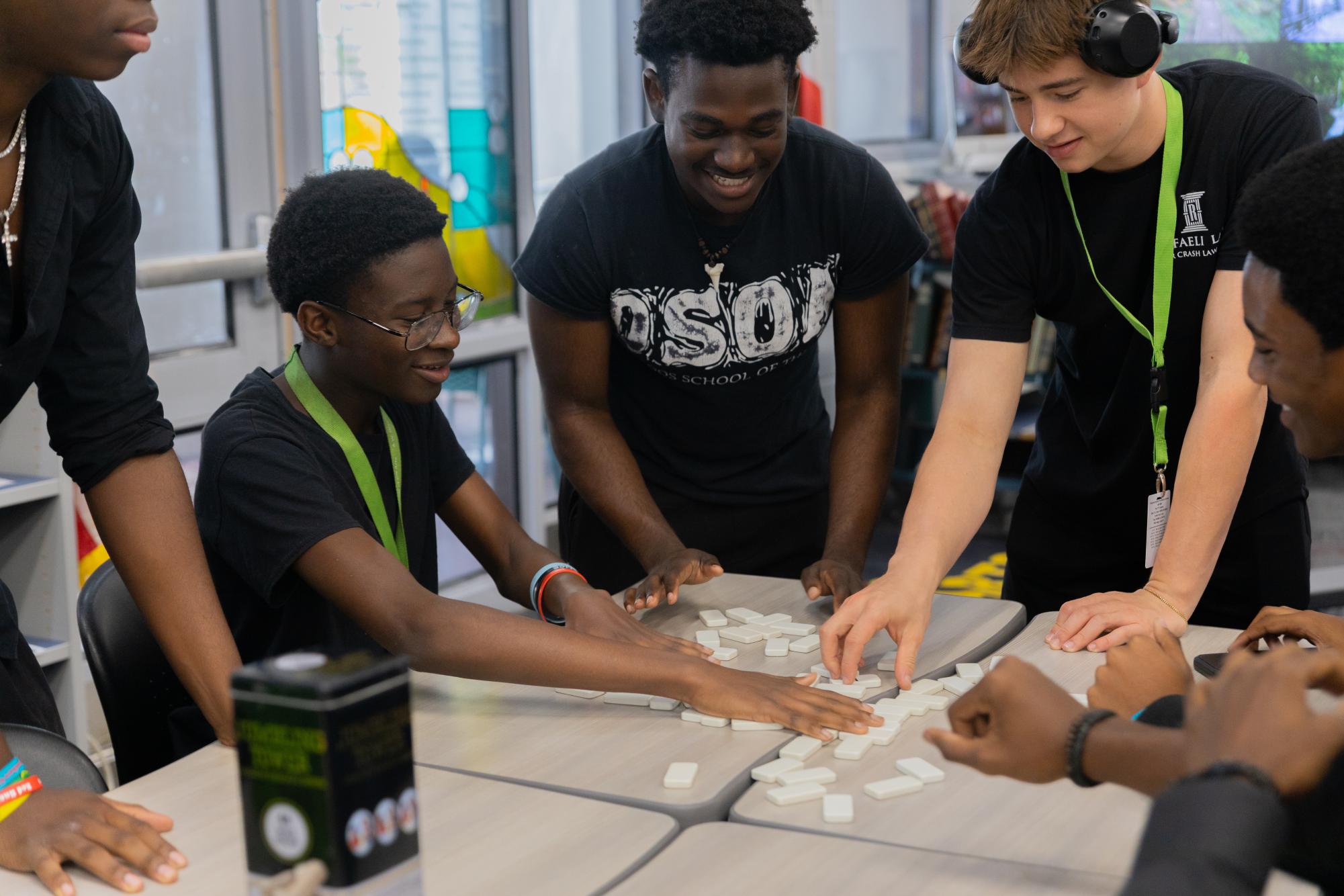 Resetting dominoes for his next round of play, theatre sophomore Jonas Jacob Joseph plays dominoes with his peers. “I just joined Black Student Union this year, and it’s been a very cool and lively experience to be a part of,” Joseph said. “I love the games here and how everyone is an awesome community.” 