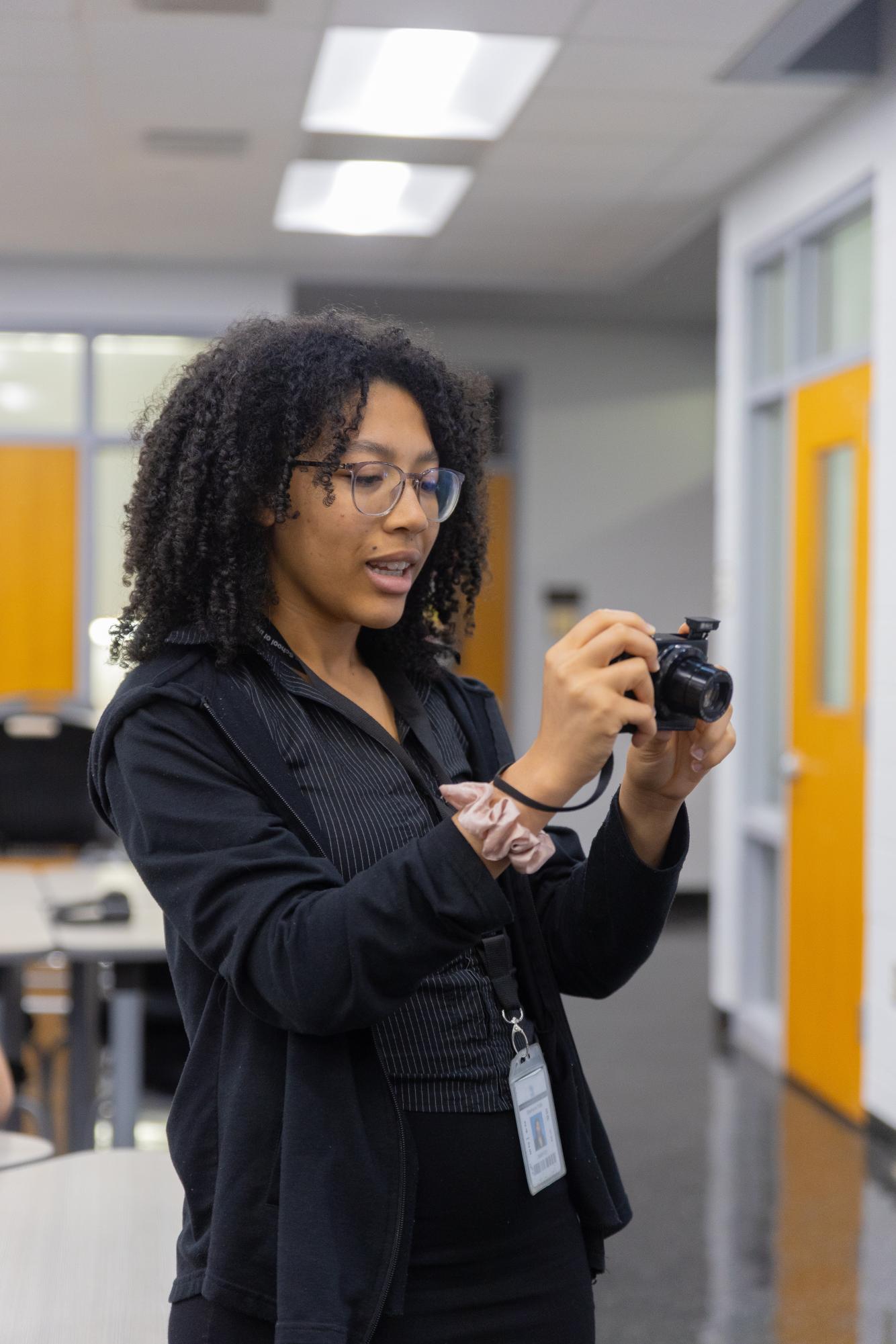 Taking photos with her camera, BSU co-historian and visual senior Stephanie Taffe captures photos of participants playing games. “I love seeing this (event) come together and everyone having fun,” Taffe said. “It’s really nice to have a community like this.” 
