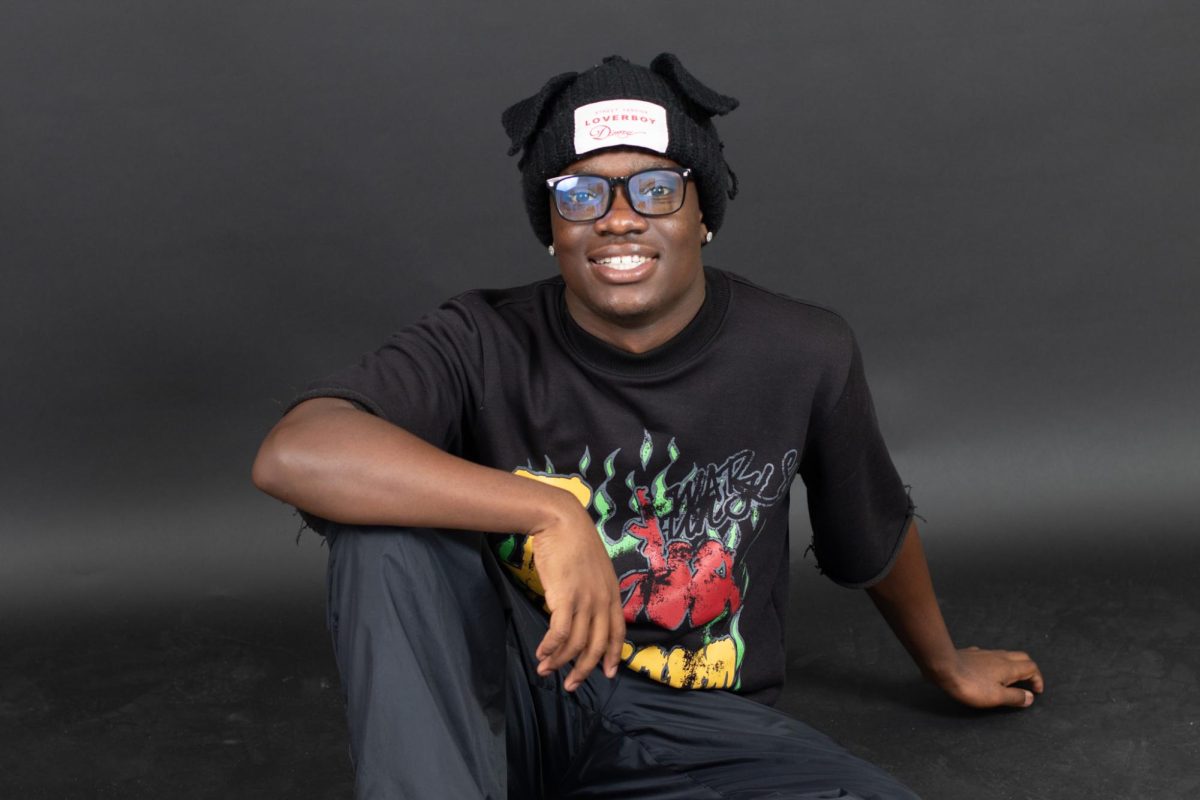 Visual senior Edluckens Augusme models his clothing brand, Rockout Studios.