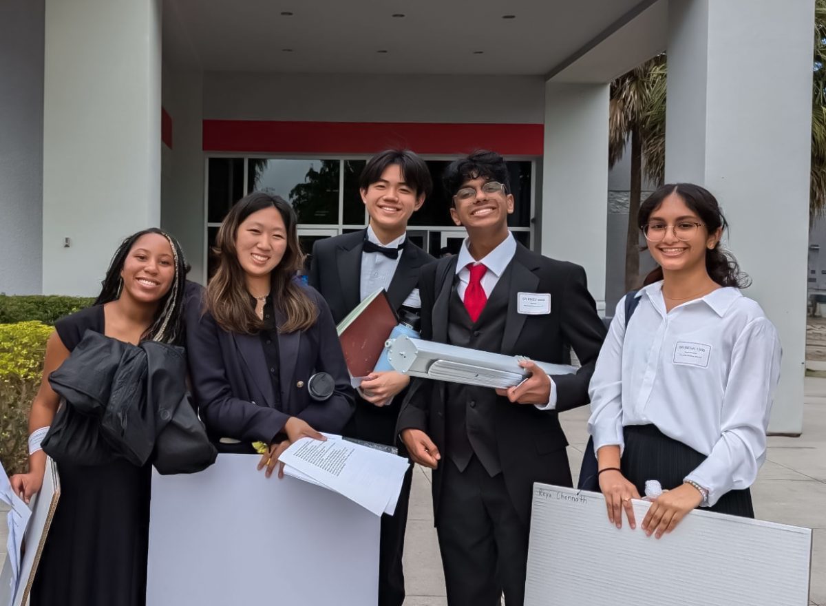 The science fair participants stand together in a posed photo. From left to right: vocal sophomore Raina Caballero, piano freshman Joanne Choi, strings senior Jeffrey Bai, piano sophomore Rishi Iyer, and communications sophomore Reya Chennath. 
Photo courtesy of Joanne Choi
