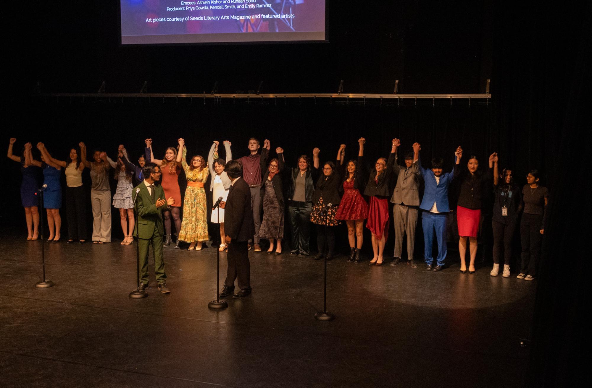 Bowing down together, performers of the Figure of Speech event close out the show.
