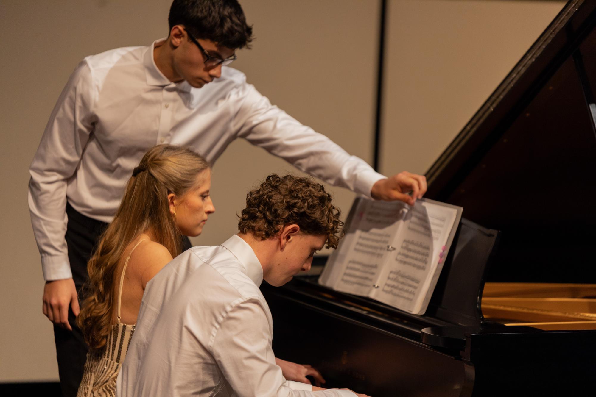 Playing a duet, piano seniors Hannah and Jeffrey Zimmerman perform the piece “Grand Galop Chromatique S. 219” together. “We feel like it was just easier to work the logistics of practicing (the piece),” Hannah Zimmerman said. “Being able to practice with my brother, it's like practicing with a friend.”