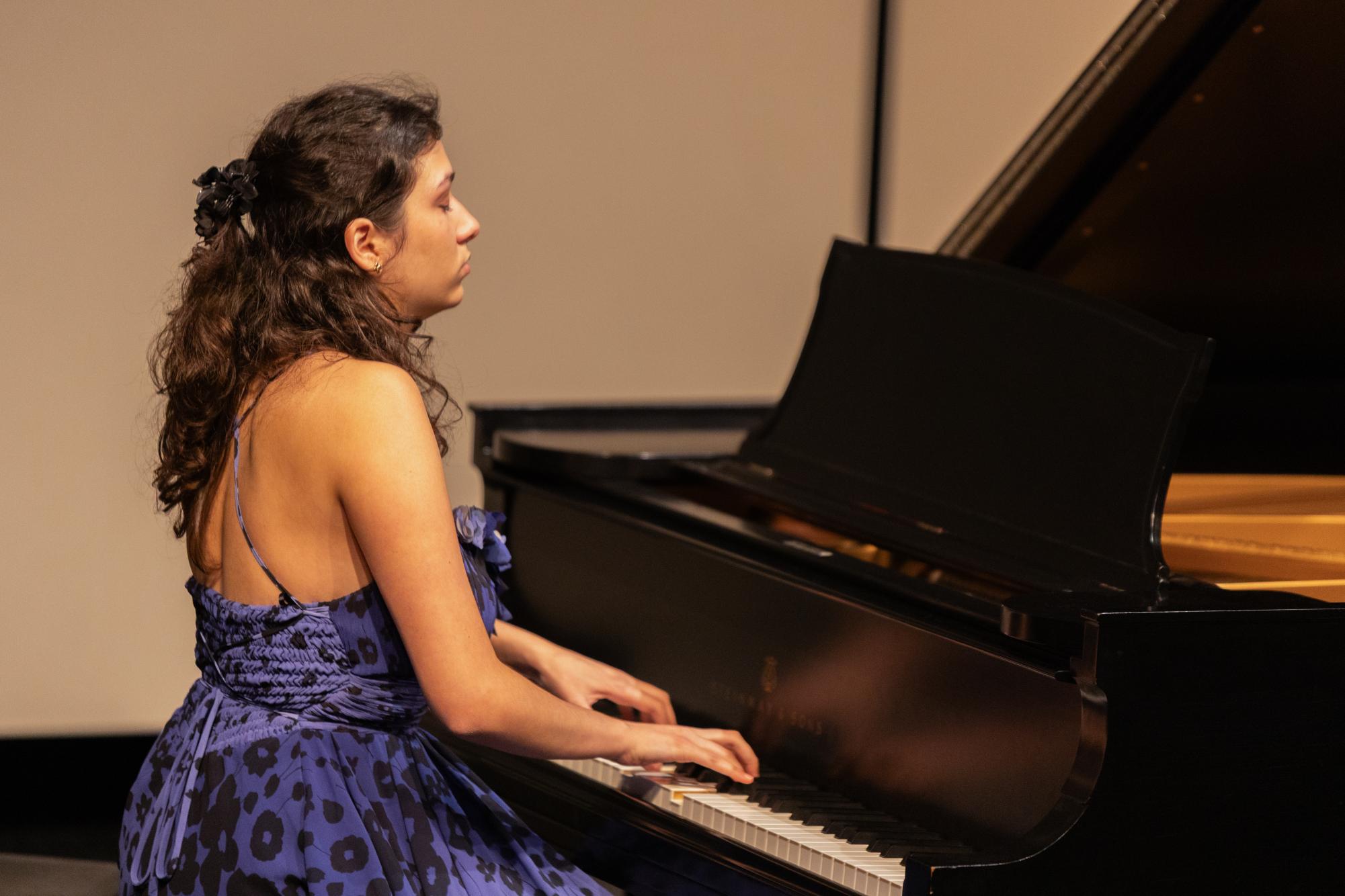 Ending her final performance piece, piano senior Ana Tejada plays the last chord of “Ballade Op. 38 No. 2” in F Major. 